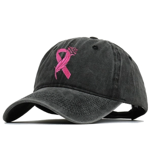 Close-up of the pink ribbon embroidery on a washed cotton baseball cap for women
