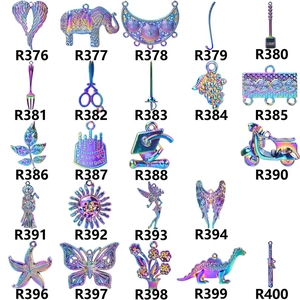 Various iridescent stainless steel DIY pendants in shapes like wings, moon, and animals