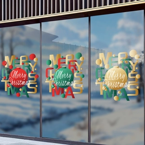Christmas ball stickers with Merry Christmas text on a glass shop window display