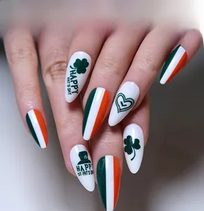 Detail of St. Patrick's Day stiletto press-on nails with clover and heart patterns
