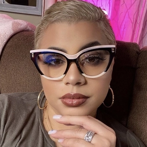 Close-up of black and white cat-eye glasses frames worn by a woman for a stylish look