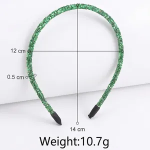 Sparkly green glitter headband for women featuring festive sequins and black end tips