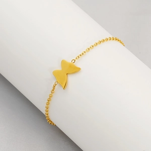 Elegant gold butterfly bracelet with fine stainless steel chain on display