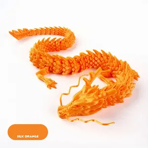 Detailed macro view of 3D printed dragon with articulated joints in silk orange finish