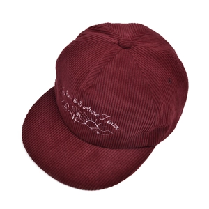 Detailed embroidery on burgundy corduroy baseball cap featuring cactus and quote text