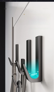 Detail of black wall-mounted hooks featuring anti-slip Golden R-angle and matte metal finish