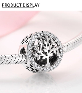 Macro shot of S925 silver Tree of Life charm bead with sparkling cubic zirconia pavé