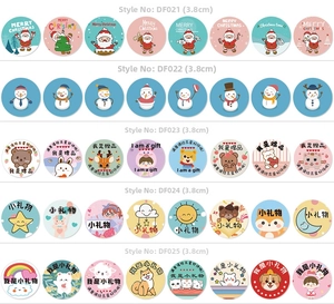 Detail showing 3.8cm circular Thank You stickers with floral and cartoon animal designs
