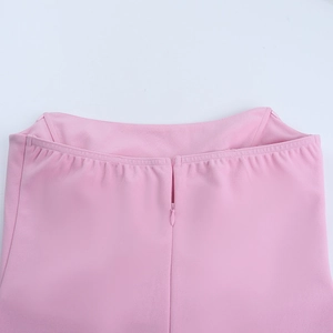 Detail of invisible zipper and clean stitching on the pink bodycon dress waist