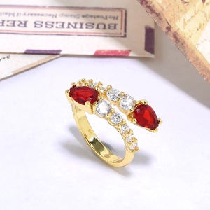 Double-layered 18K gold plated ring with pear-cut red zircon and white crystal accents