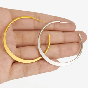 Size comparison of large minimalist round hoop earrings in gold and silver finish
