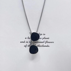 Hip hop silver chain necklace with black sunglass pendant on white paper background