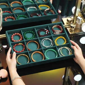 Dark green velvet 12-grid jewelry display tray for bracelets, watches, and accessories