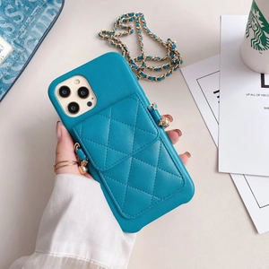 Blue quilted leather iPhone case with card slot and gold chain crossbody strap