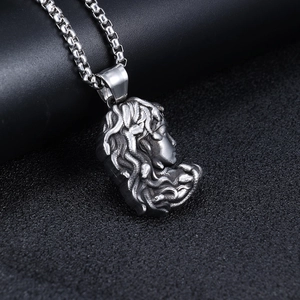 Retro stainless steel Medusa pendant necklace with a vintage silver finish on black surface
