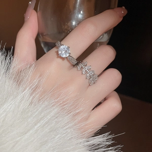 Close-up of sparkling zircon snowflake rotating ring set on model hand with luxury feel