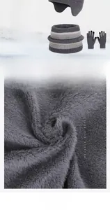 Detail of soft fleece lining inside kids knit winter hat, scarf and glove set