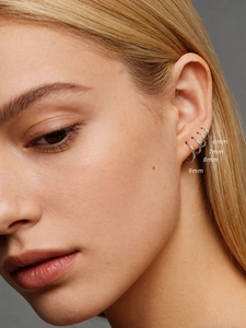 Close-up of S925 sterling silver hoop earrings in sizes 6mm, 7mm, 8mm, and 9mm on ear