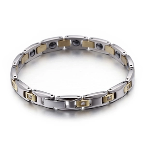 Men's titanium steel magnetic bracelet with rhinestones and gold accents on silver links