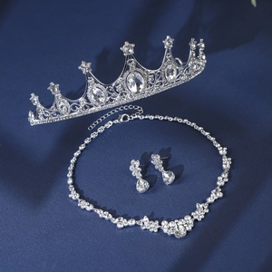 Close-up of bridal jewelry set with silver metal crown and sparkling crystal rhinestones