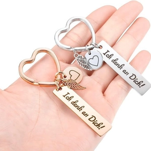 Porte-clés cœur en or rose et argent avec ailes d'ange et gravure texte allemand