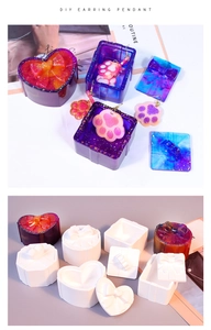 Detail showing silicone gift box molds and colorful resin crafts with bow-tie decorations
