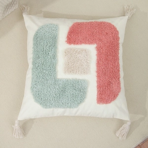 Minimalist tufted pillow case with geometric patterns and tassels on white cotton fabric