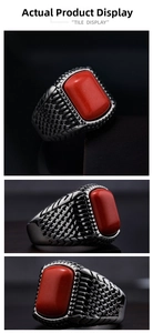 Detail view of vintage punk ring with rectangle red stone and engraved metal band