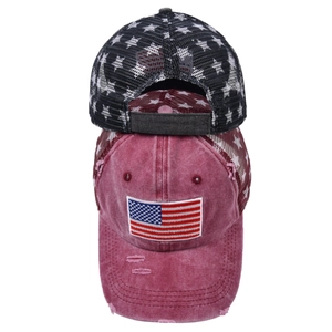 Detail of vintage American flag patch and star mesh on breathable baseball caps