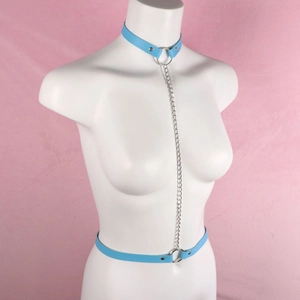 Detail view of light blue PU body harness with silver metal chain on a white mannequin