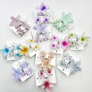 Glittery gradient plumeria hair claw clip set in various colors for tropical vacations