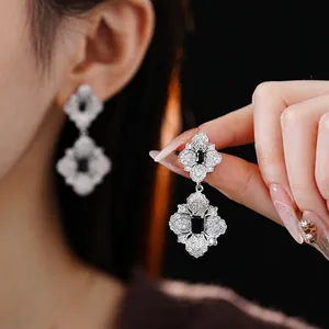 Silver flower jewelry set with black rectangular stones and zircon diamond accents