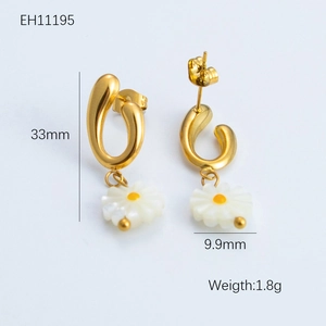 Detail view of gold daisy earrings with dimensions 33mm length and 9.9mm width