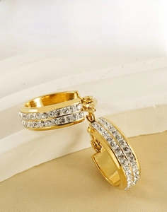 Detail of 18K gold stainless steel hoop earrings with double row rhinestone inlay