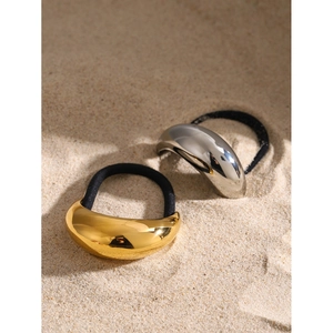 18k gold and silver U-shaped metal hair ties on sand, high-elastic black hair rope