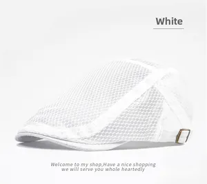 Detail of white mesh newsboy cap showing breathable fabric and bronze metal adjustment buckle