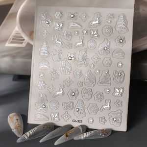 Detailed relief of Christmas nail stickers with snowflakes and reindeer on gray nails