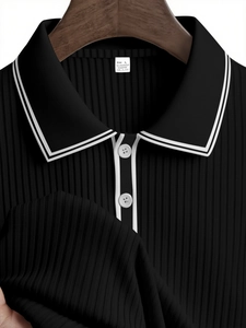 Detailed close-up of ribbed texture and contrast piping on the black long sleeve polo collar