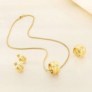 Golden stainless steel jewelry set featuring cylinder necklace, ring, and earrings set