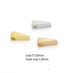 Macro detail of 3x10mm triangular stainless steel beads in gold, silver, and rose gold