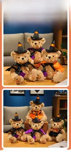 Detail of Halloween teddy bear wearing a witch hat and pumpkin dress for holiday gifts