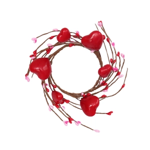 Red heart berry candle ring wreath with pink berries on a rustic brown branch base