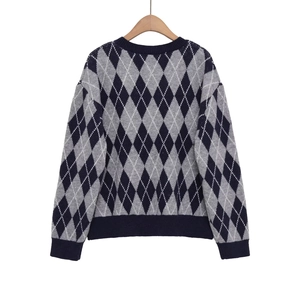 Women's V-neck argyle knit sweater in navy blue and white with long drop shoulder sleeves