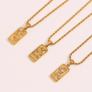 Detail of 18K gold plated tarot pendants with rope chain featuring relief engravings