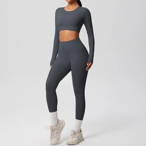 Detail of dark grey seamless yoga set with long sleeve crop top and high waist leggings