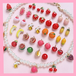 Detailed collection of mini gold-plated fruit charms and a pearl necklace for DIY jewelry