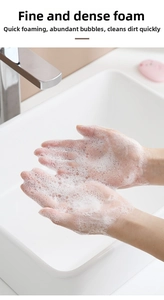 Close-up of rich white foam on hands showing portable soap sheets cleaning effect