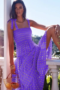 Detailed view of purple floral smocked bodice with adjustable bow tie straps
