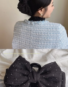 Detail of black mesh bow hair claw clip with rhinestones in meteor shower style