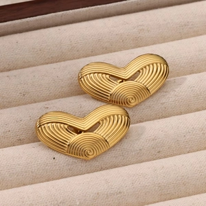 Golden heart earrings with spiral ribbed texture displayed in a premium jewelry box